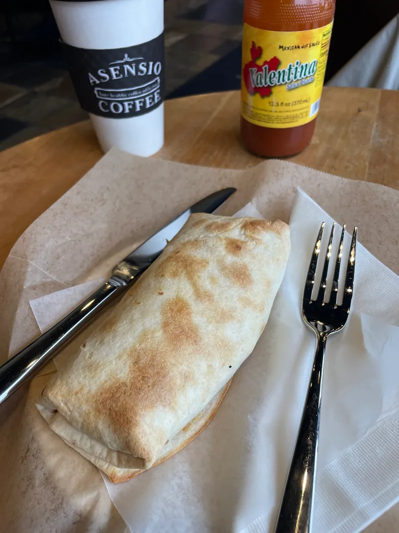 Breakfast item with a fork at Asensio Coffee